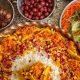 طرز تهیه هویج پلو با مرغ و زرشک؛ غذای سنتی، خوش‌رنگ و خوش‌طعم ایرانی